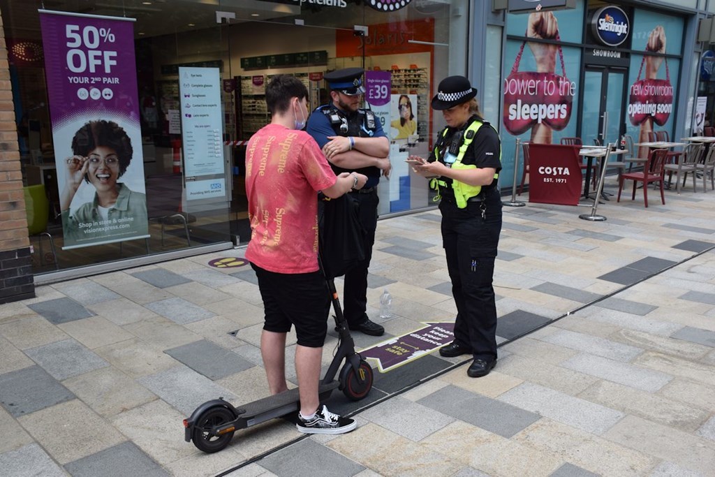 File photo of a youngster on an e-scooter quizzed by police in Bracknell town centre